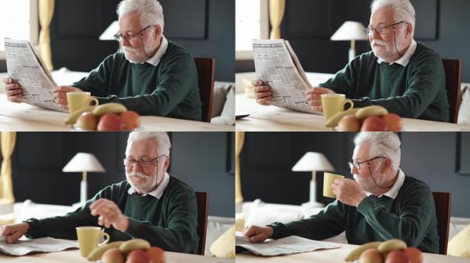 资深微笑的爷爷看报纸，喝咖啡。退休早晨例行公事