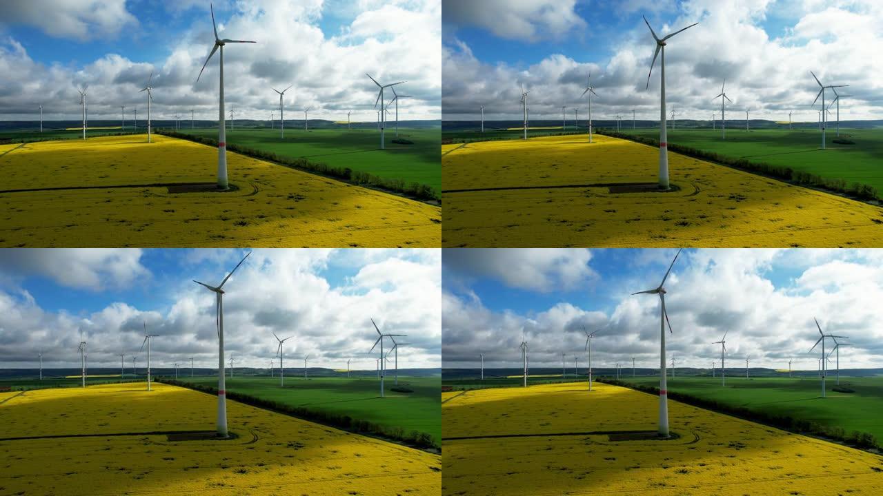 绿色能源-风力涡轮机和盛开的黄色油菜籽田