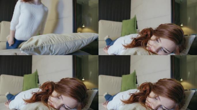 精疲力竭或无聊的学生女生倒在沙发上。有趣的女孩睡着了，感觉缺乏动力。