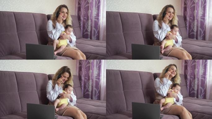 快乐的母亲在智能手机上谈论将女婴抱在怀里