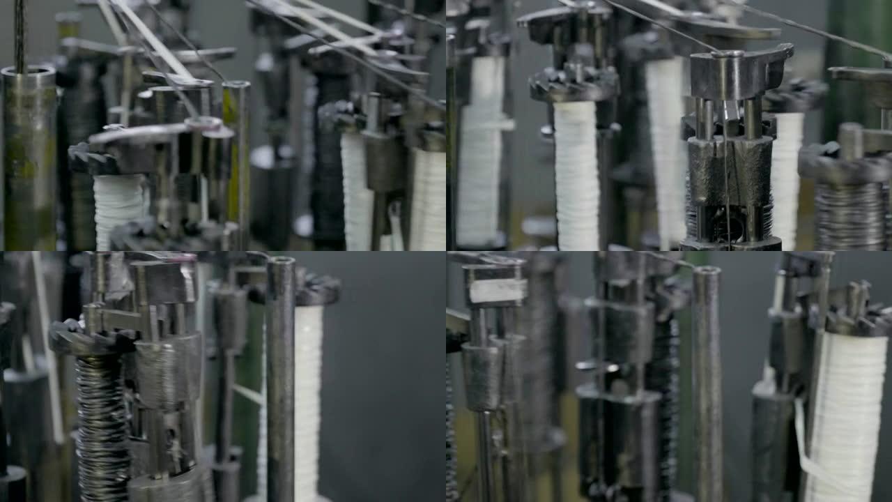 自动工业缝纫机，用于编织不燃电缆的编织物。