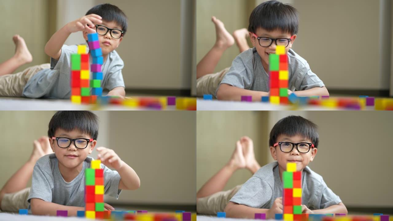 亚洲蹒跚学步的孩子玩创意益智玩具