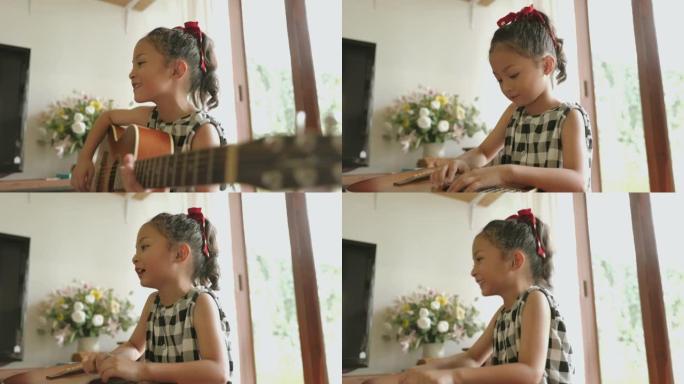 可爱的孙女在家弹吉他-股票视频