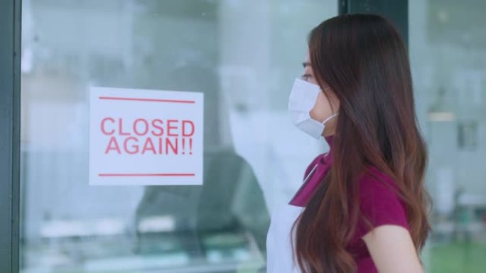 亚洲女性咖啡馆企业主压力很大的手递店因covid的传播而再次关闭，我们将关闭，直到进一步通知下一波疫