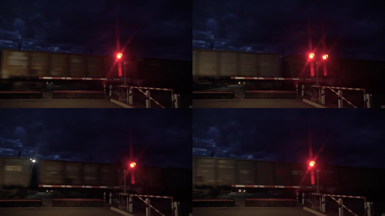 铁路交通信号灯为红色。在铁路道口停车的停车信号。火车在铁轨上高速运动。禁止交通灯信号