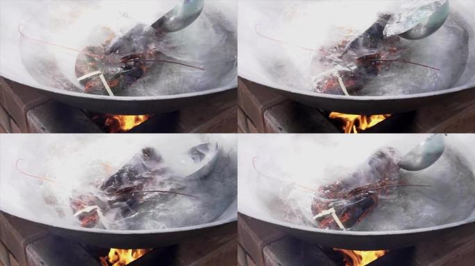 龙虾在煎锅中的热水中煮沸，龙虾在锅中煮沸