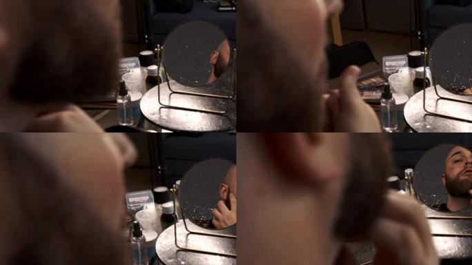 一名男性化妆师将产品涂在脖子上的4k视频片段