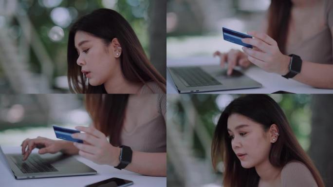美丽微笑的年轻亚洲女性通过智能手机上的移动应用程序管理网上银行，并在喝杯咖啡，放松和享受下午的时光的
