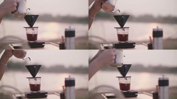 将热水倒入滴头以制作手滴咖啡。