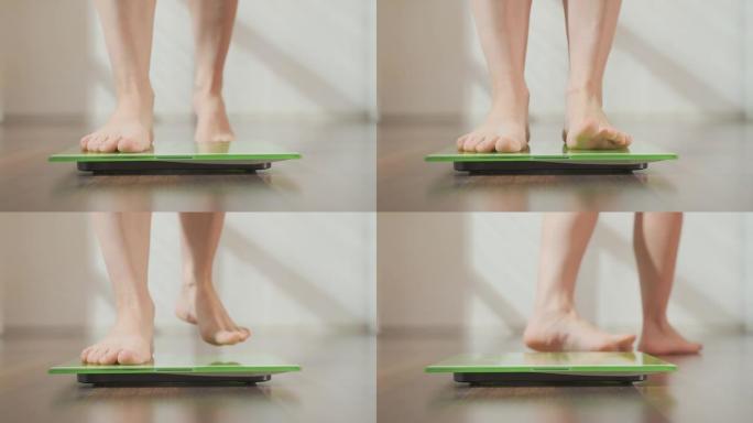 女人检查体重。女性脚在地板上测量秤