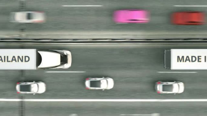沿高速公路行驶的带有泰国制造文字的半挂卡车的俯视图。泰国商业相关可循环3D动画