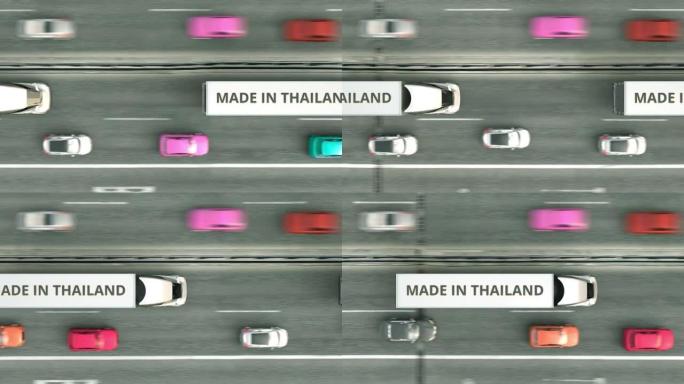 沿高速公路行驶的带有泰国制造文字的半挂卡车的俯视图。泰国商业相关可循环3D动画