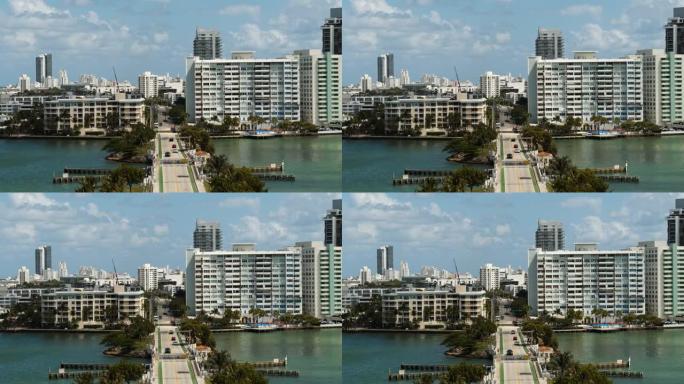 沿着威尼斯堤道向威尼斯群岛上偏远的迈阿密海滩鸟瞰图。无人机制作的带有转发摄像机运动的视频。