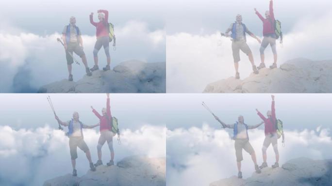 快乐的高加索高级夫妇在快速移动的云层上的山顶上