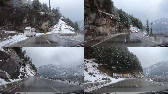 冬季，印度喜马al尔邦Manali的汽车在两侧积雪覆盖的山脉中行驶过度