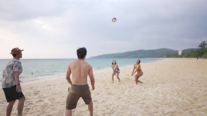 4k组亚洲朋友夏天在沙滩上打球
