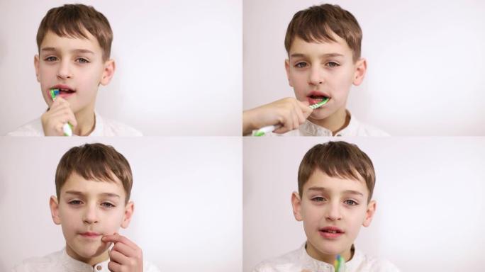 小男孩在白色背景上刷牙，健康的嘴的概念