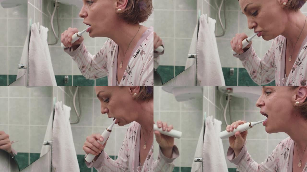 女人用电动牙刷刷牙