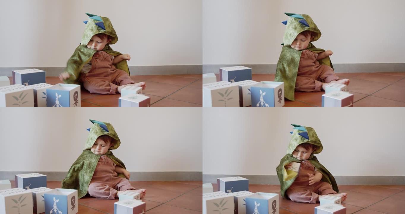 一个可爱的男婴在家里玩耍，穿着龙嘉年华服装-慢镜头视频