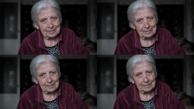 看着坐在家里的相机，颤抖着紧张不安的老妇人的肖像