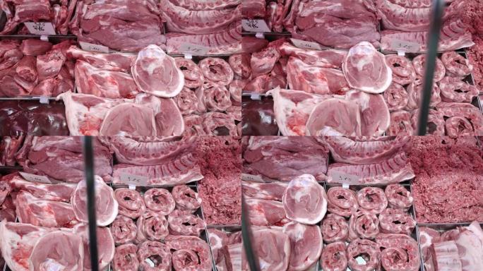 超市柜台上的肉。切碎的肉和猪肉放在金属容器中。肉类销售