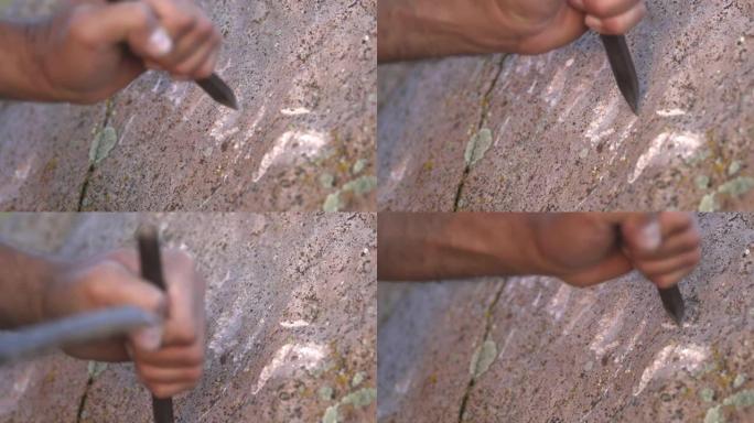 古人洞穴绘画和书写历史铭文用铁凿在岩石表面涂鸦