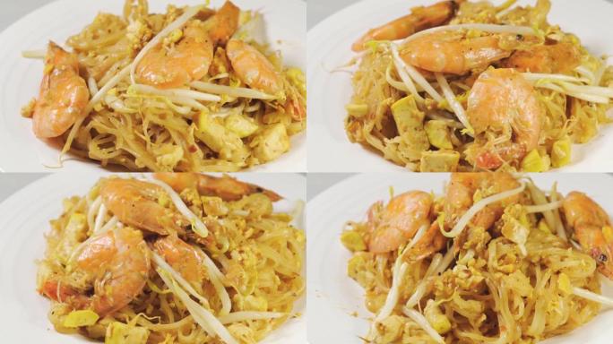 泰式垫的转盘外观。由面条和虾制成的泰国菜。泰国名菜。宏顶拍。