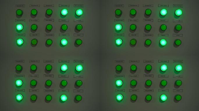 制造机械上点亮的绿色按钮灯的特写镜头