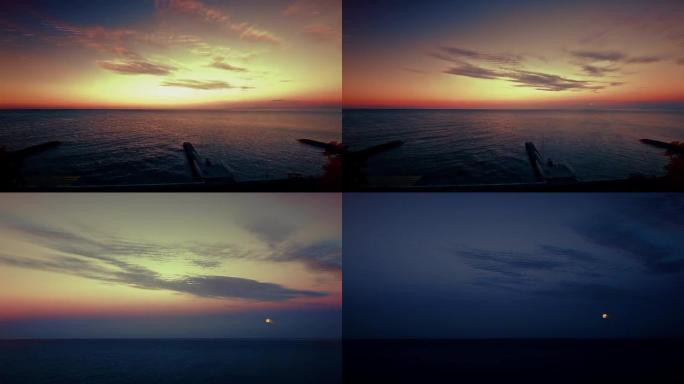 日落月景背景下的海滨
