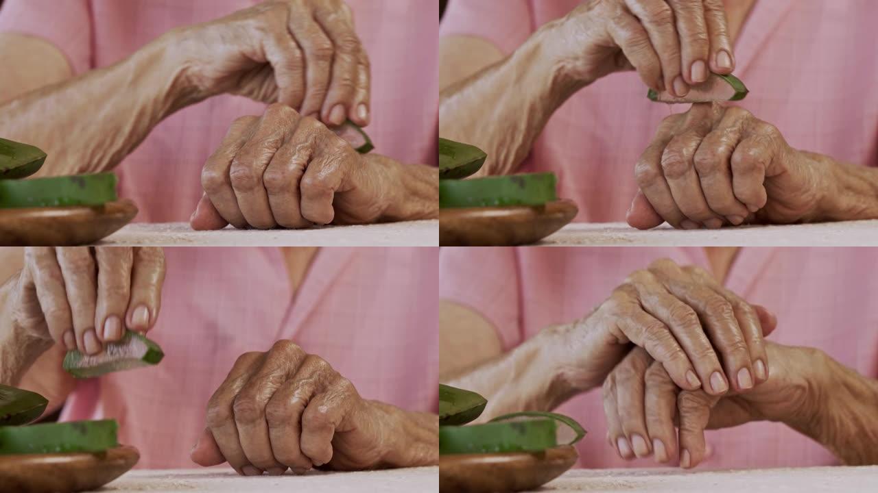 西班牙裔高级女性慢动作特写，用芦荟保湿乳液搓手，作为皮肤保护的常规
