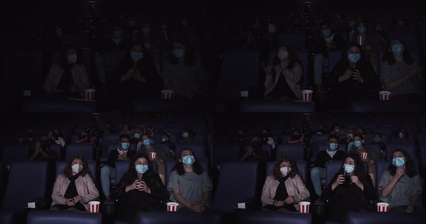 在新型冠状病毒肺炎冠状病毒大流行期间，人们在电影院看电影