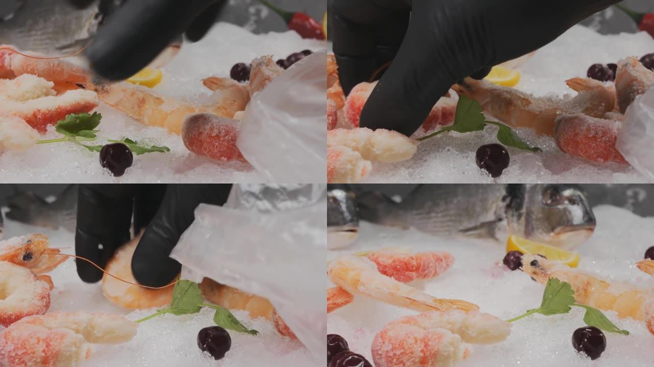 海鲜商人的手从展示柜中拿出新鲜的冷冻虾，并将其放在塑料袋中，以供顾客使用。亚洲海鲜市场。多莉拍摄，特