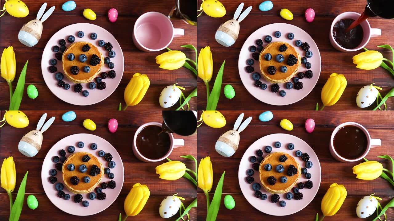 复活节早餐。一叠煎饼，复活节兔子，彩蛋和咖啡倒入杯子中。节日乡村餐桌。顶视图