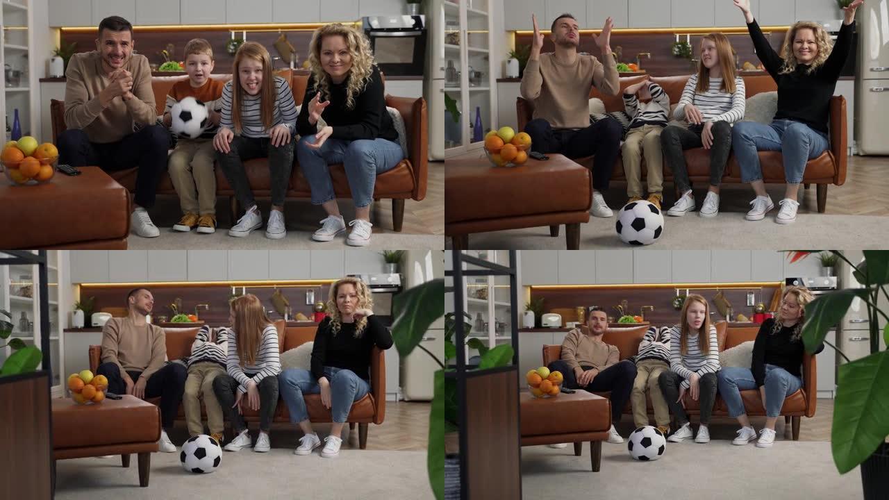 兴奋的聋哑家庭在电视上观看足球比赛