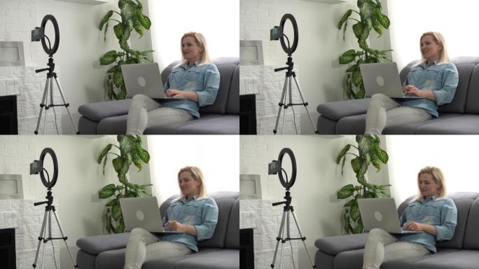 美容博主女人在三脚架上的相机上拍摄。有影响力的女士家庭工作室直播评论。