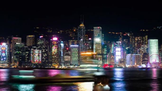 香港维多利亚港灯光交响乐表演活动之夜的延时市景。亚洲旅游目的地，旅游景点概念