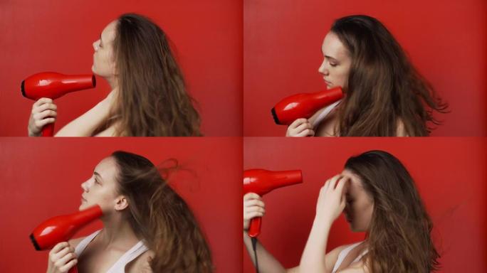 女孩用红色背景的吹风机吹干长发