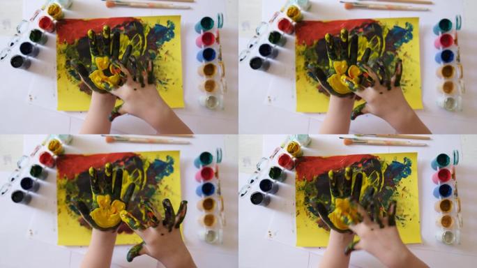 儿童用手指绘画。用指画绘画的想法。孩子们的手指画。儿童发展。快乐的童年和儿童节的概念。