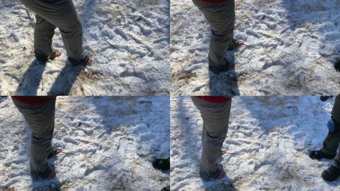 一个人赤脚站在雪地里。女孩赤脚走在雪地里。