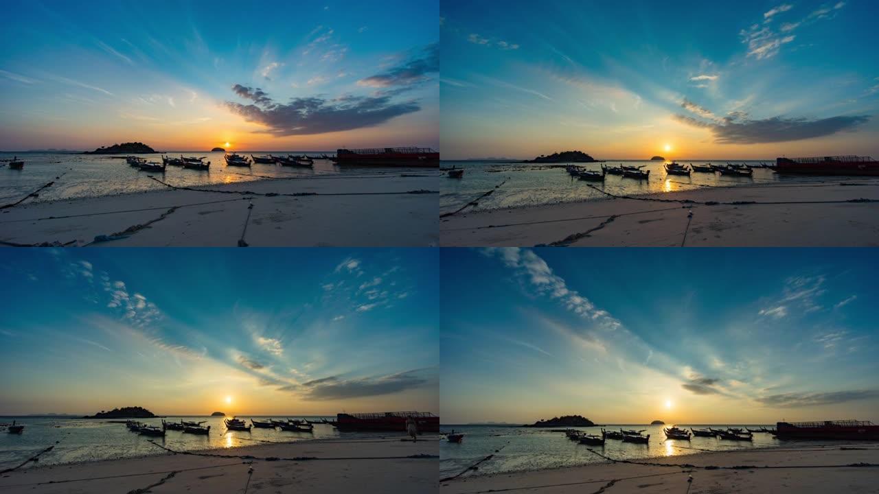 黄昏日出时的渔船剪影，阳光反射和戏剧性的云
