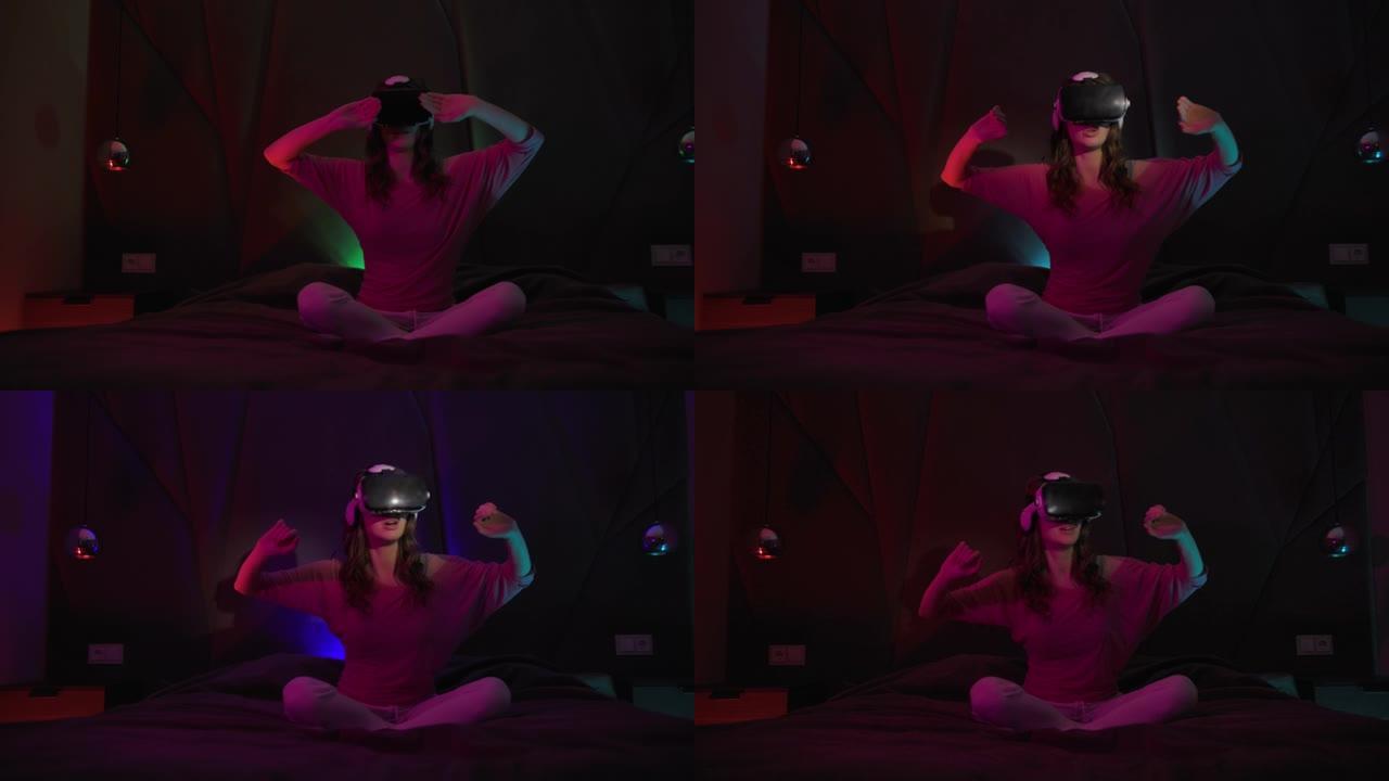 年轻女子使用虚拟或增强现实眼镜坐在黑暗房间的床上