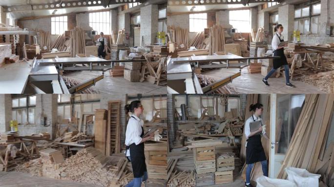木匠妇女在自己的木工车间工作