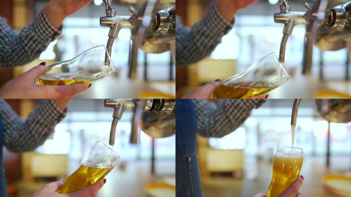 无法识别的女调酒师将啤酒倒入玻璃杯中