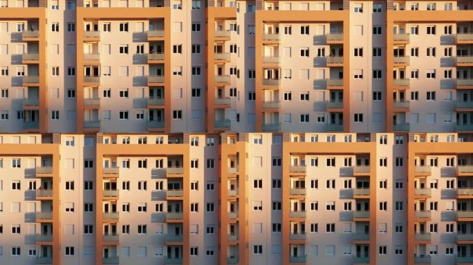 一栋新的高层多层公寓楼的外观-立面，窗户和阳台。建立资助公共住房项目的拍摄航拍镜头。公寓抵押和房地产