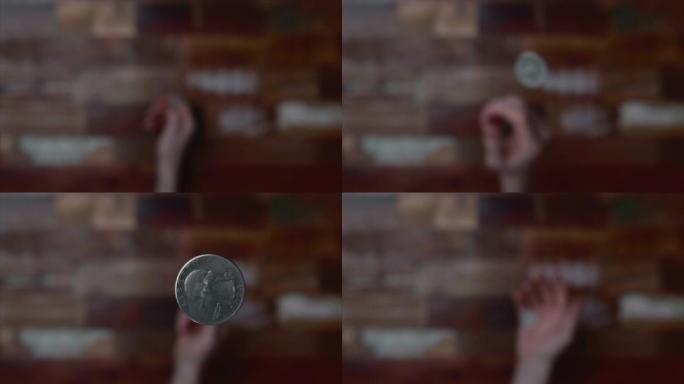 硬币在掷硬币中被人的手在空中翻转2