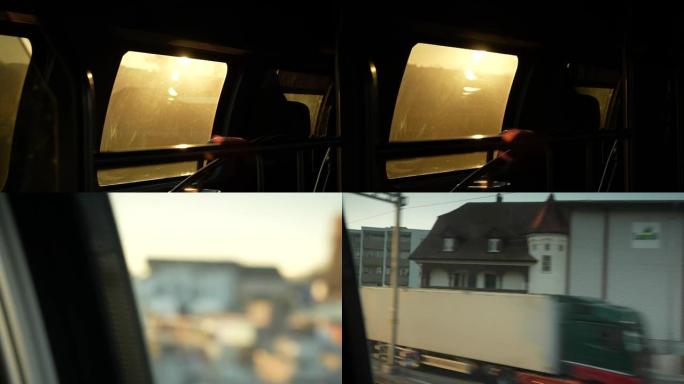 金色日落光束在车内移动的火车窗户上