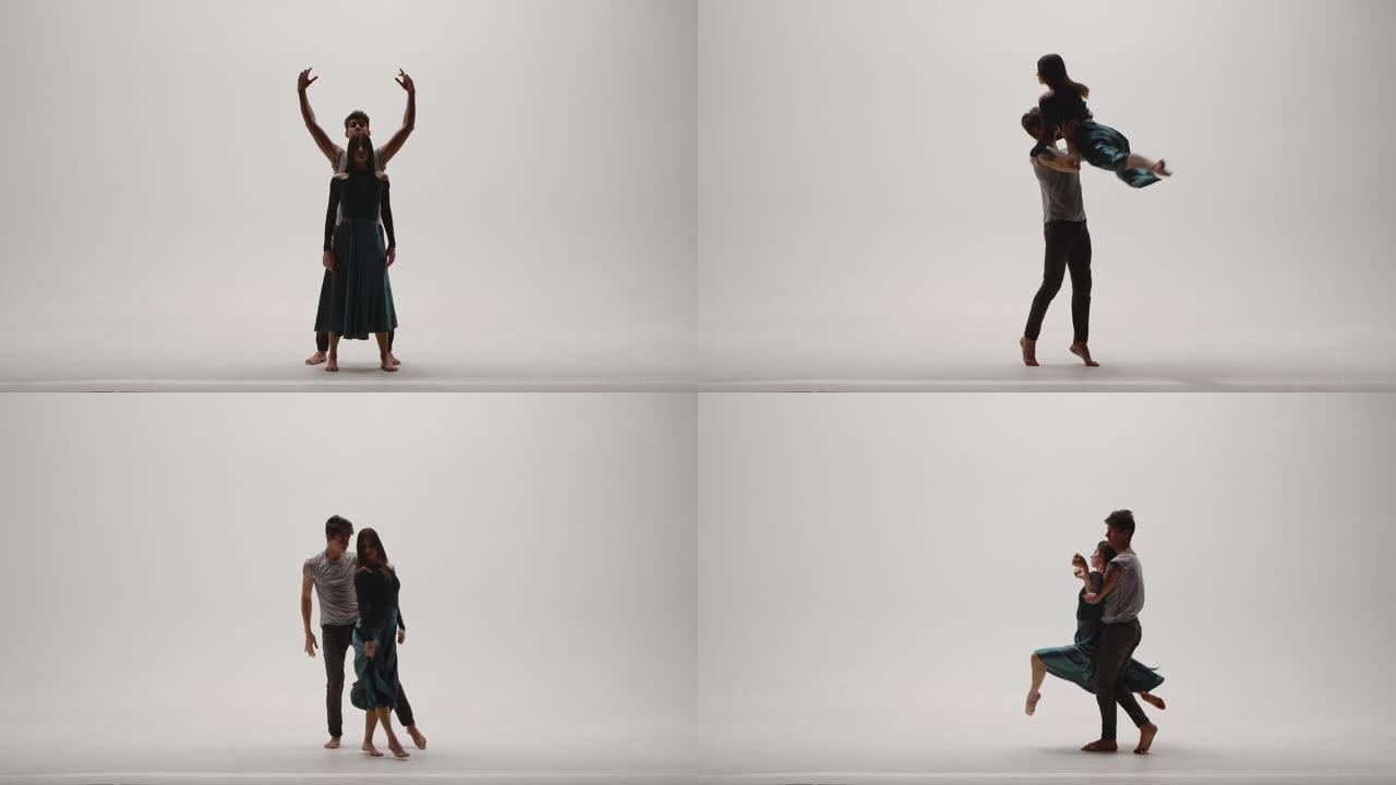 现代编舞的元素，由一对年轻的舞者在白色工作室背景下表演。男人和女人热情地跳舞，用舞蹈表达自己的感受。