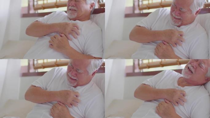 紧急情况亚洲老年老年男子突发心脏病，胸部疼痛和疾病，糖尿病症状仅在床上就需要紧急帮助，老年护理理念
