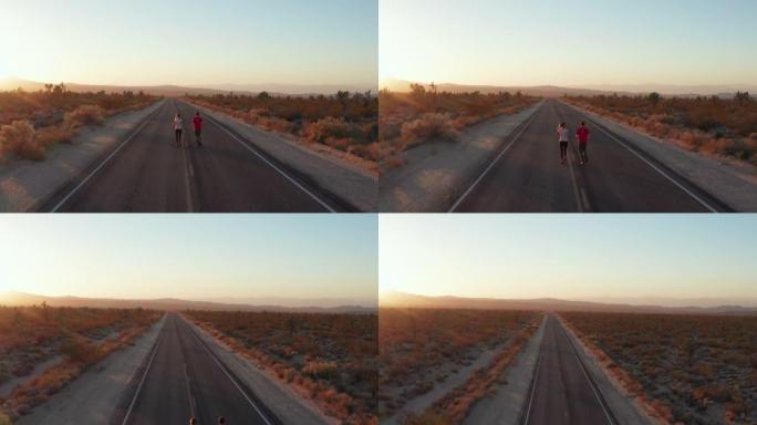 日落时分，人们在空旷的路边慢跑的空中镜头。