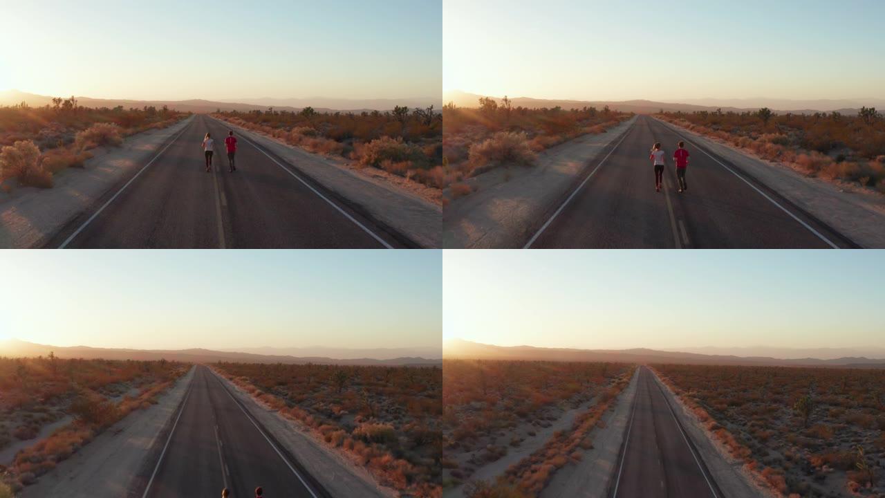 日落时分，人们在空旷的路边慢跑的空中镜头。
